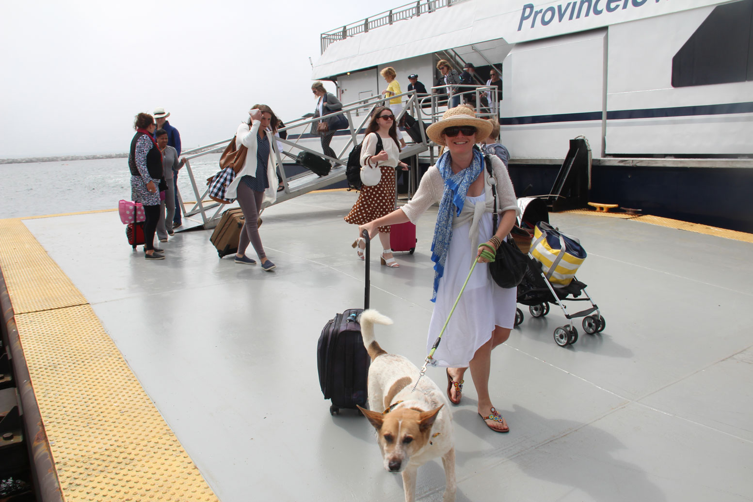 MacMillan-ferry-woman-dog-arriving-ENogiec